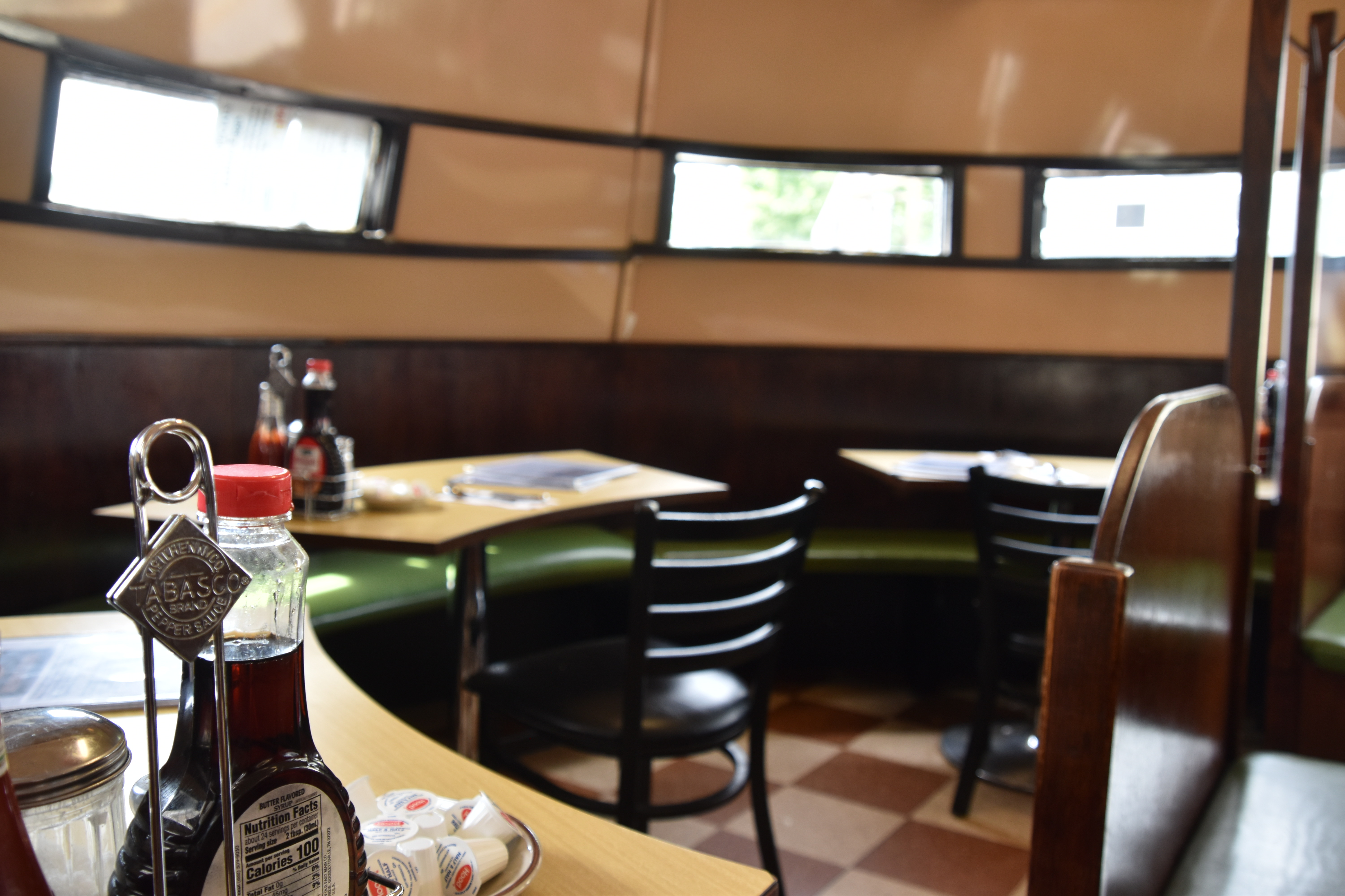 Retro diner booth seating with condiments