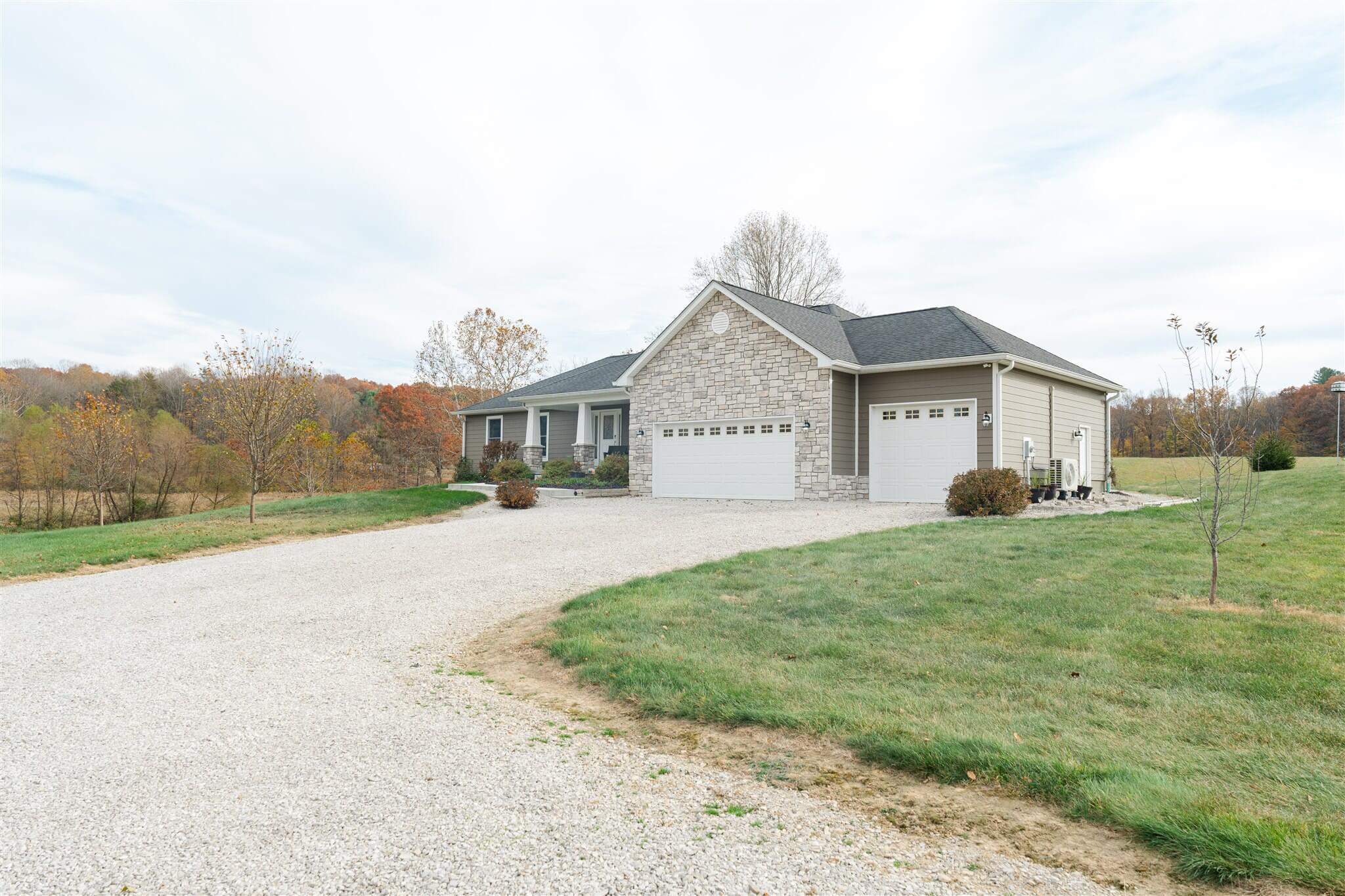 Exterior front view of The Homestead with gravel drive