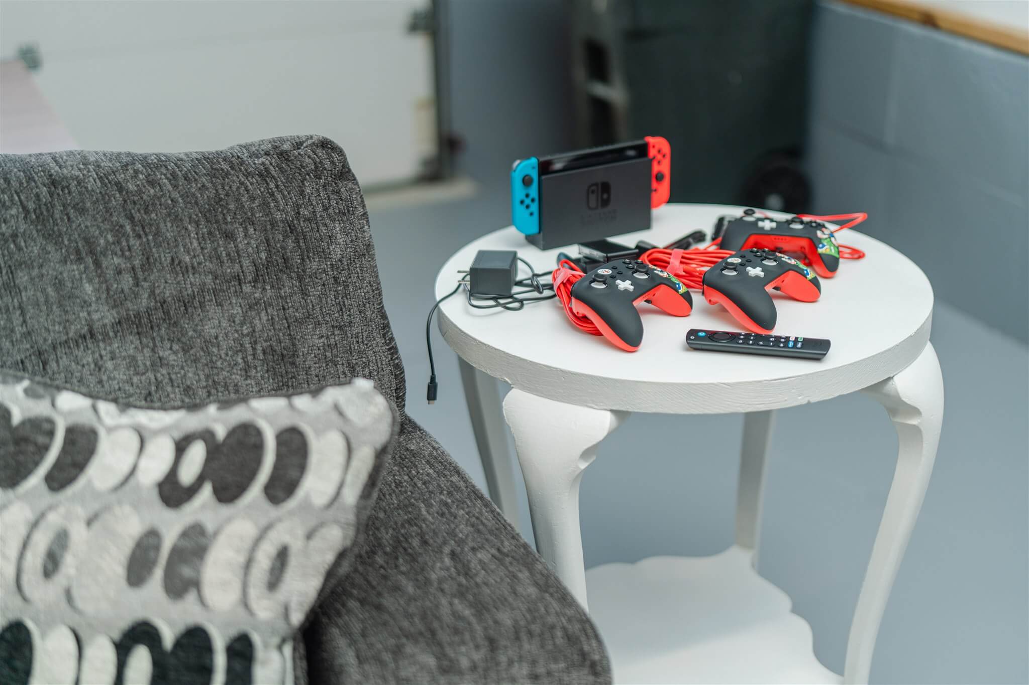Nintendo Switch setup with game controllers on side table