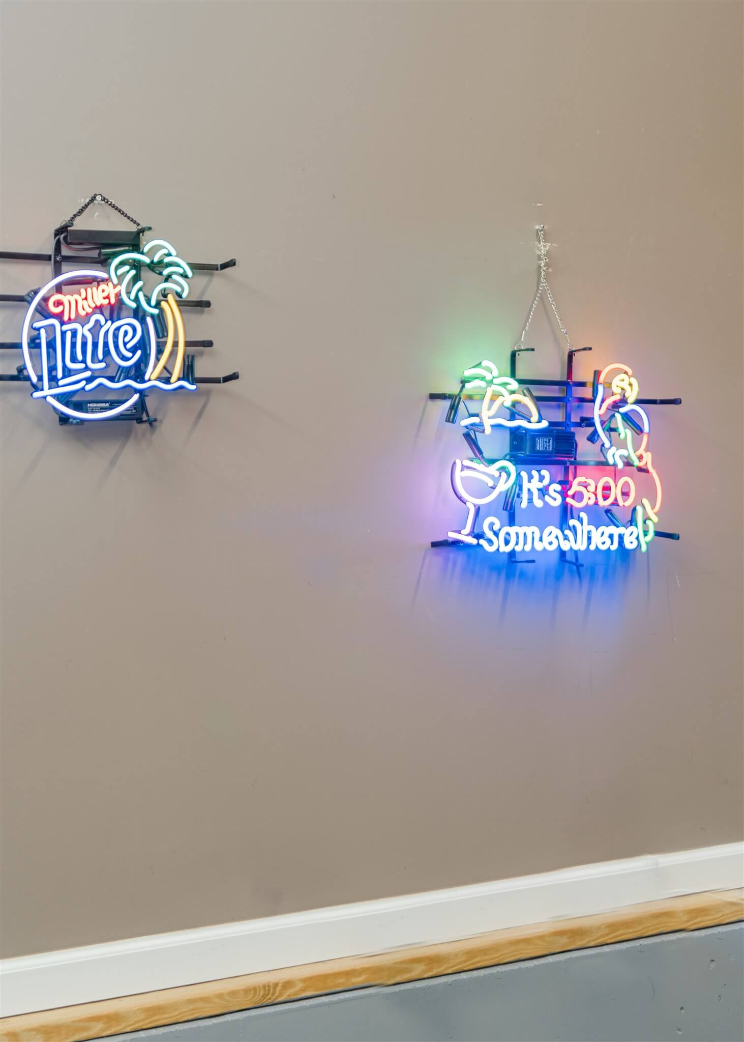 Neon beer signs on lounge wall