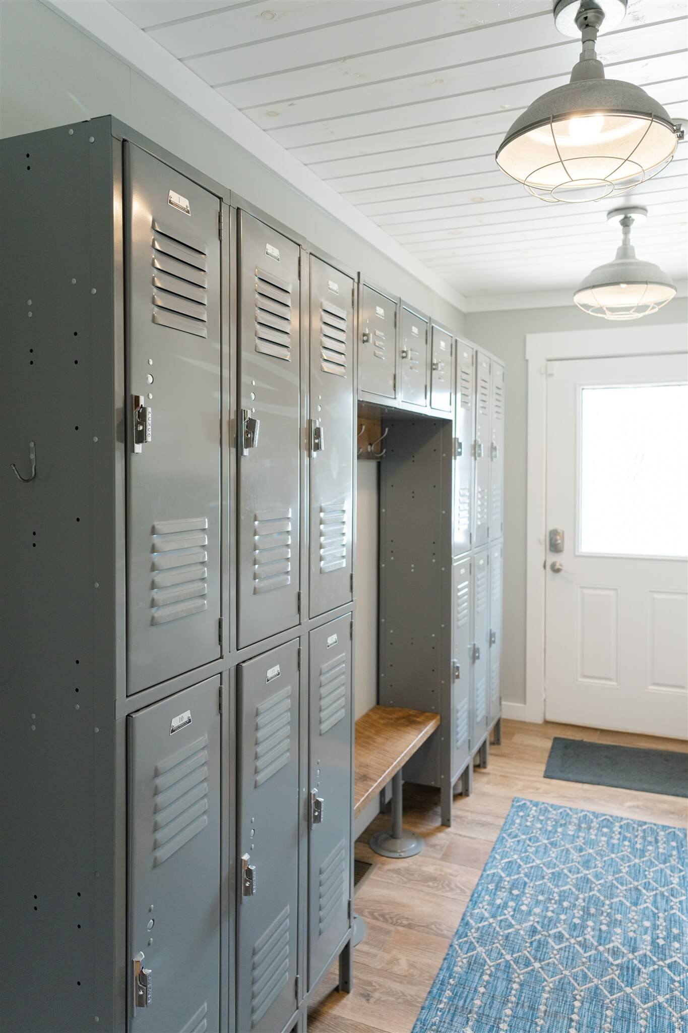 Mudroom hallway with gray lockers