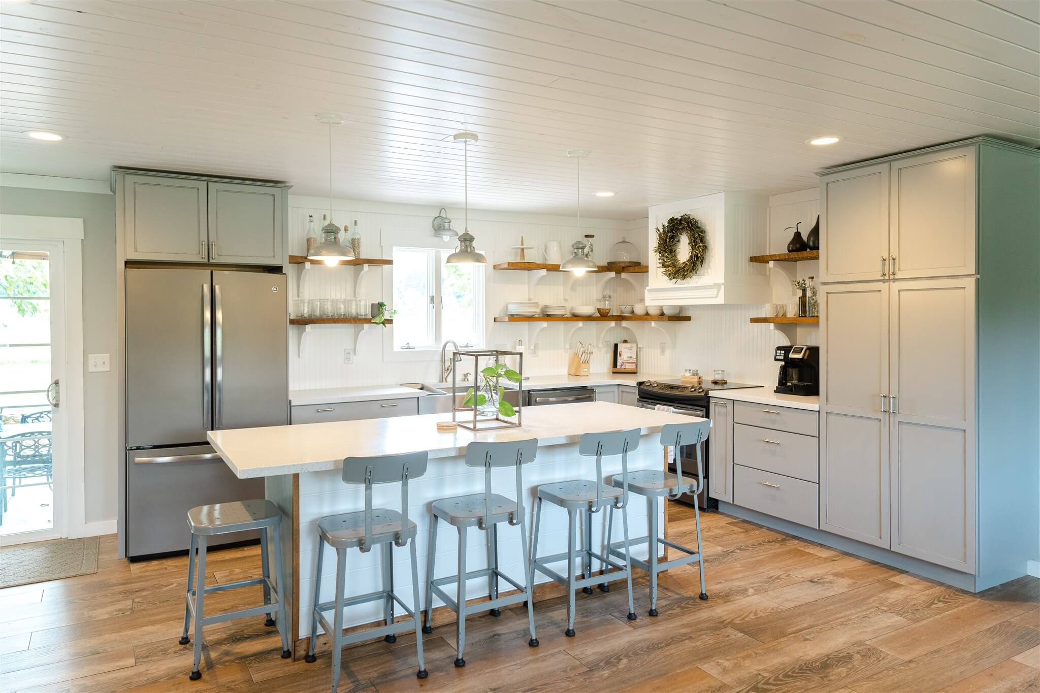 Spacious kitchen with island seating and open shelves