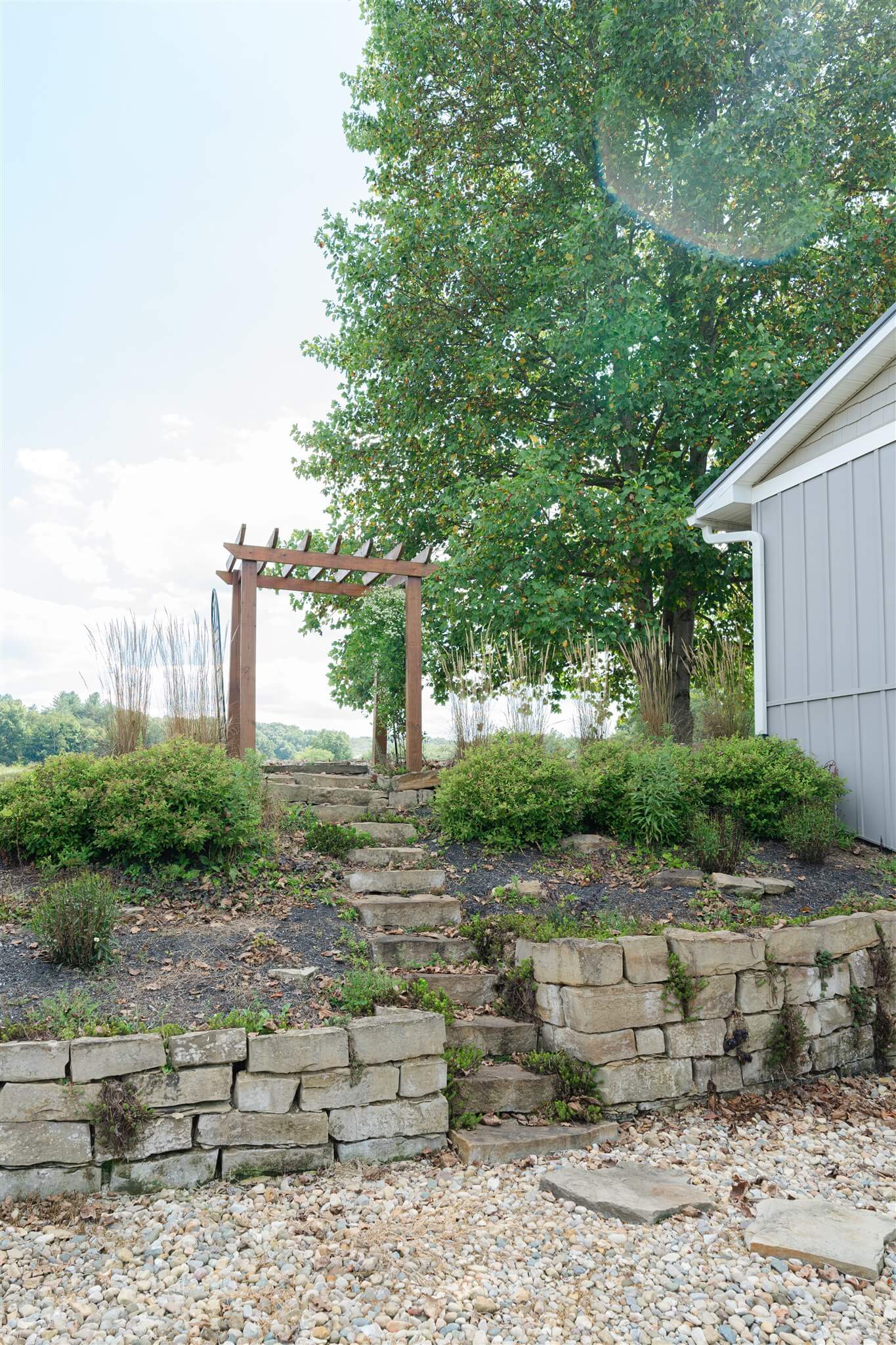 Stone steps and pergola beside The Villa exterior