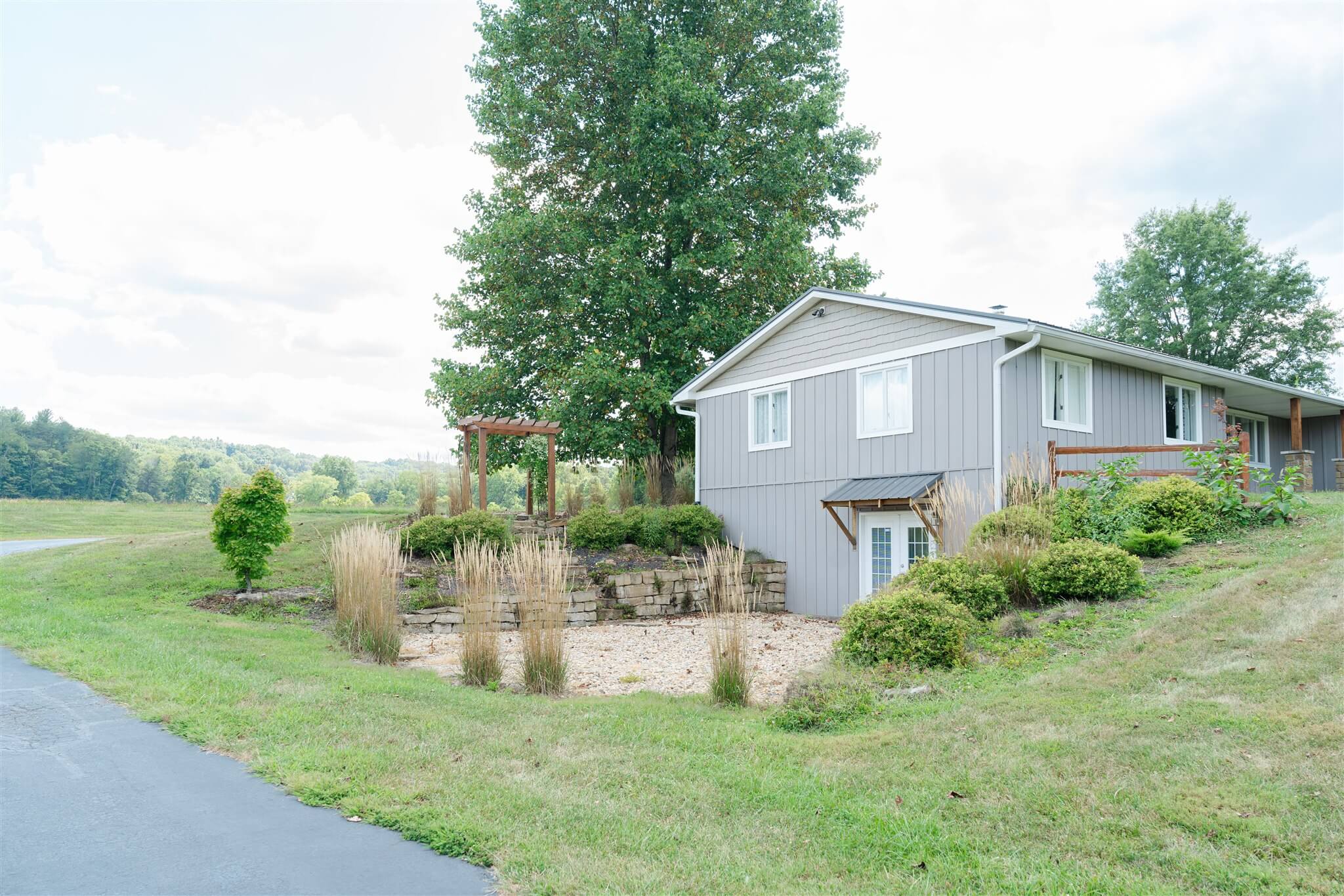 Back exterior of The Villa overlooking fields