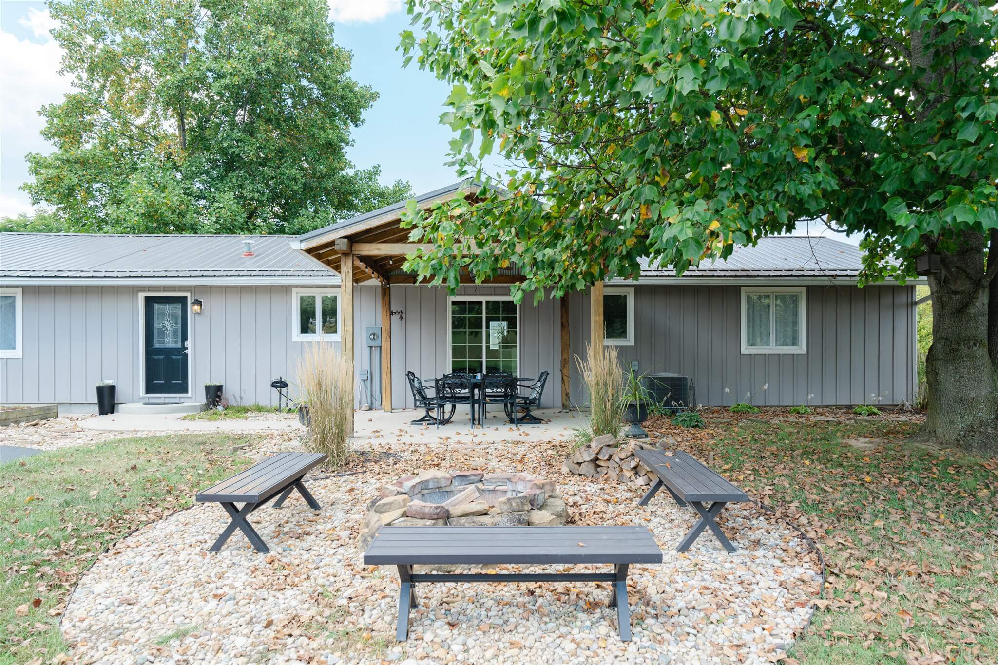 Outdoor fire pit and covered patio at The Villa